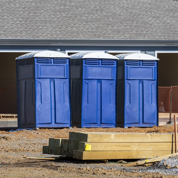 what is the cost difference between standard and deluxe portable restroom rentals in Mason